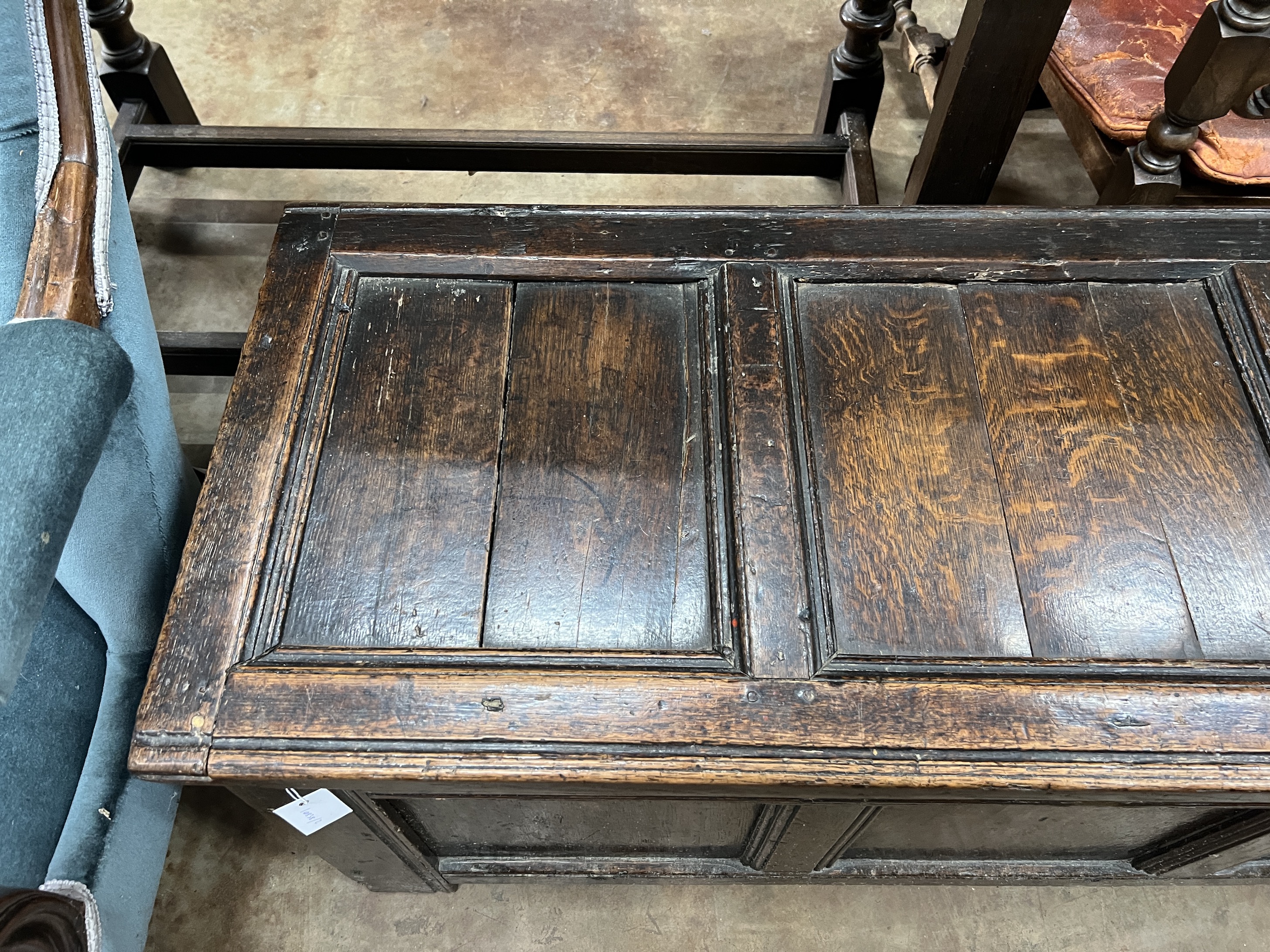 A late 17th / early 18th century panelled oak coffer, width 125cm, depth 50cm, height 50cm